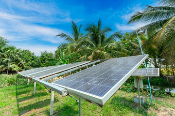 photovoltaic solar power panel for agriculture in a rural houses area Agricultural fields blue sky...