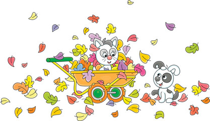 Happy little puppy and kitten playing with colorful autumn leaves and a handcart in a yard of a village house in countryside, vector cartoon illustration on a white background