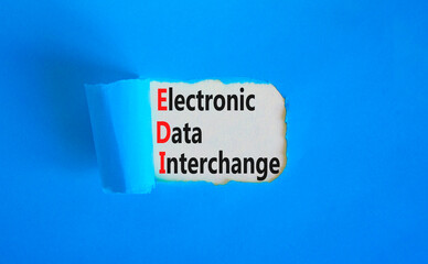 EDI electronic data interchange symbol. Concept words EDI electronic data interchange on white paper on a beautiful blue background. Business and EDI electronic data interchange concept. Copy space.