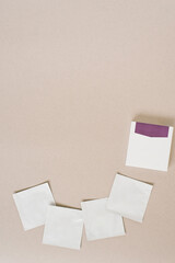 Disposable bags of cosmetics lie on a beige background