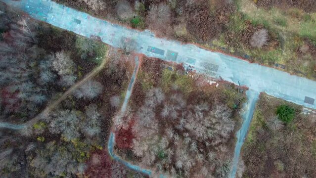 Aerial top down of graffiti road in Fall around abandoned coal town Centralia Pennsylvania