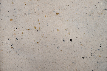 Beige matte granite texture with splashes