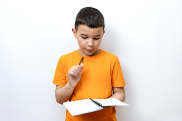 Guy shows expression of decision by raising pen up while holding notebook. Sincere children's...