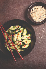 Chinese salad, cucumbers with chili pepper and sesame seeds, homemade, no people,