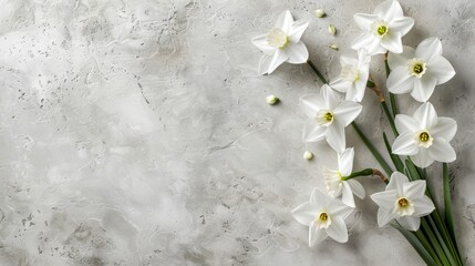   A marbled surface bears several bunches of white daffodils, their stems emerging green from the midst