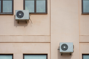 Outdoor air conditioning unit. A large modern air conditioner on the wall of an apartment building....
