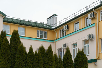 Outdoor air conditioning unit. A large modern air conditioner on the wall of an apartment building. Repair and maintenance of the air conditioning system
