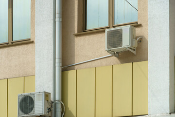 Outdoor air conditioning unit. A large modern air conditioner on the wall of an apartment building. Repair and maintenance of the air conditioning system