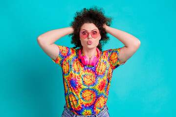 Photo of cheerful carefree funny girl wear trendy vivid print clothes have fun sed kiss isolated on cyan color background