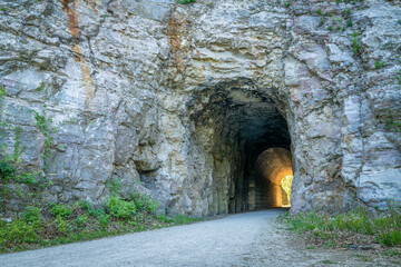 MKT tunnel on Katy Trail at Rocheport, Missouri. The Katy Trail is 237 mile bike trail stretching across most of the state of Missouri converted from an old railroad. - obrazy, fototapety, plakaty
