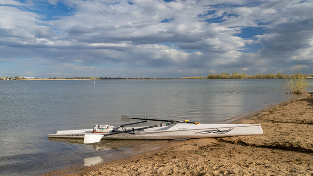 Loveland, CO, USA - April 29, 2024: Coastal rowing shell by Liteboat on a shore of Boyd Lake in northern Colorado in early spring scenery.
