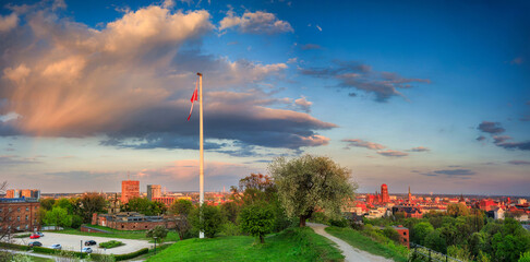 Beautiful blooming tree and the Main City of Gdansk at spring sunset, Poland - obrazy, fototapety, plakaty