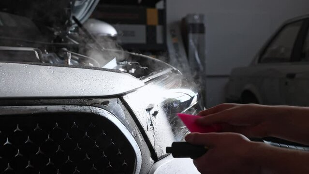 Gluing PPF film on a car with the steam for protection of the car surface against mechanical abrasion, UV, IV and road contamination
