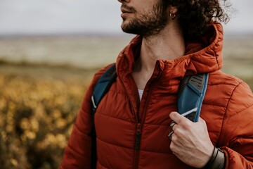 Man wearing orange jacket for outdoor activity photo