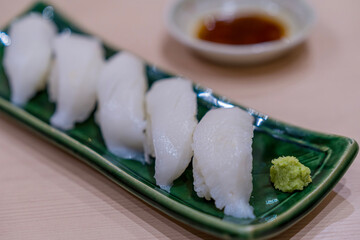 Japanese sushi set. Sushi Engawa on plate. Fluke Fin Sashimi.