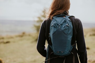 Woman with backpack for hiking, winter apparel photo
