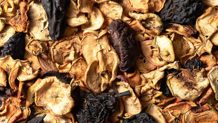 Close-up of background with dried apples, dried fruit background. Sun-dried fruit for making...