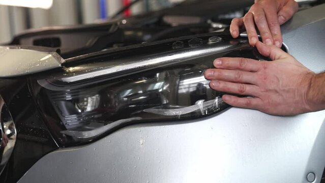 Gluing PPF film on a car with the steam for protection of the car surface against mechanical abrasion, UV, IV and road contamination