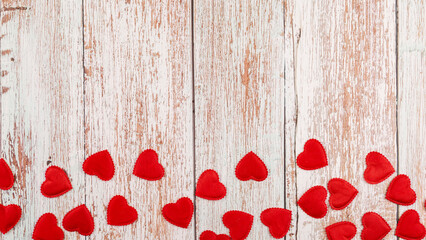 Wooden background with hearts for valentine's day. Beautiful wrapping paper or background for a postcard. Place for text, banner for website