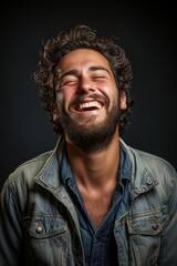 Obraz premium Joyful man with curly hair and beard