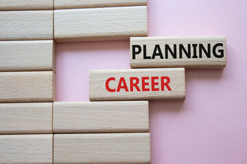 Planning Career symbol. Wooden blocks with words Planning Career. Beautiful pink background....