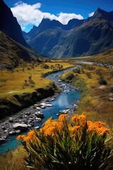 Majestic mountain landscape with vibrant wildflowers and a winding river