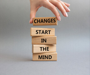 Changes start in the Mind symbol. Wooden blocks with words Changes start in the Mind. Beautiful...