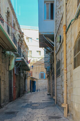 Narrow alleyway between old stone buildings in Jerusalems old city