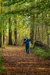 Obraz premium Man walking alone in the Laerbeek woods, Jette, Belgium