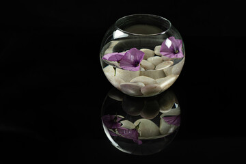 flowers floating in glass container