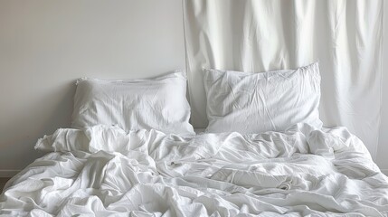   A bedroom features a bed draped in white sheets and pillows The room is adorned with a white curtains across the window, and behind the bed lies another white curtain
