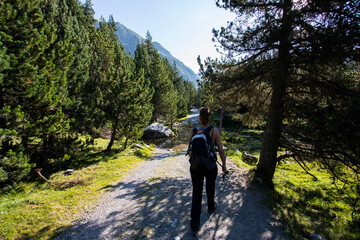 Young hiker woman in Vall de Boi, Aiguestortes and Sant Maurici National Park, Spain