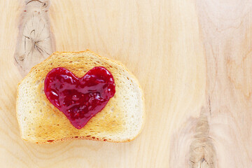 Toast with jam in the shape of a heart