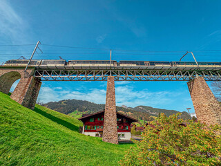 Train crossing deck truss bridge