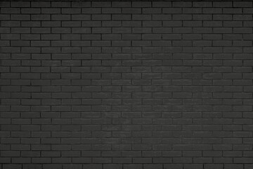 Texture of a black brick wall. Abstract construction background.
