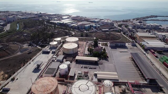 Aerial view of fuel tanks. Oil storage tanks aerial view. Oil and gas storage terminal. Petrochemical refinery plant