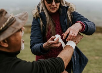 Woman wrapping elastic bandage, first aid