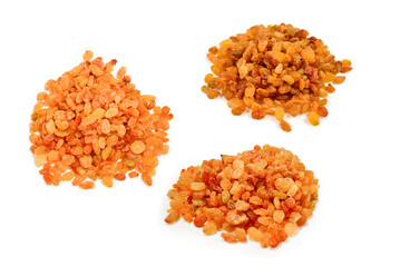 Golden raisins isolated on white background.