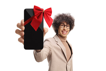 Cute young man holding a smartphone with red bow