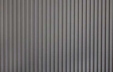 Grey wall panel. Seamless background texture of grey painted wood paneling, metal siding, ribbed...