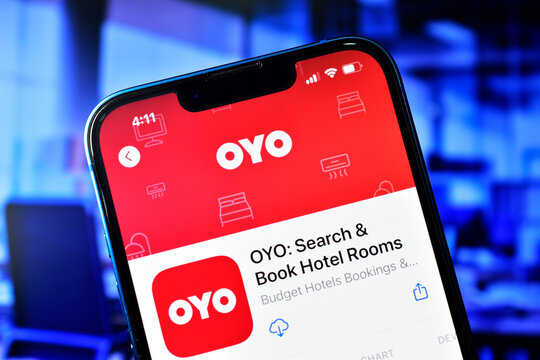 Oyo app on smartphone used to book hotel room