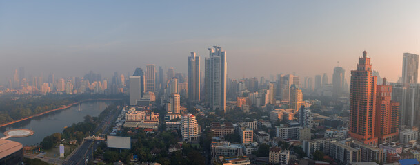 Aerial panoramic view of Bangkok city caught in the haze under morning light.