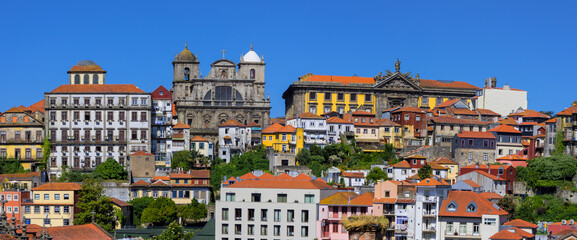 Panoramic view of UNESCO world heritage site Porto city in Portugal with blue sky.