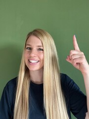 classic Stockfoto with blonde woman showing something 