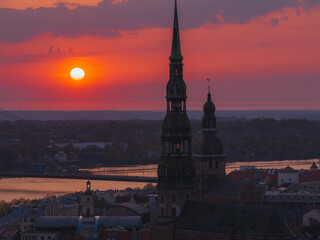 Magical aerial sunset over Riga old town, the capital of Latvia. Riga rooftop view panorama at...