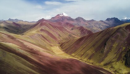 aerial view of the entire rainbow mountains in peru with vinicunca in the center and the red valley in the background
