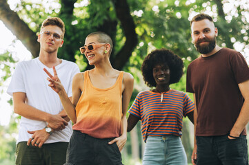 Obraz premium Interracial nature lovers posing and smiling at the camera.