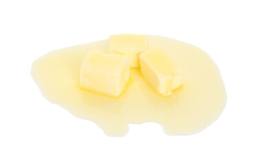 Pieces of melting butter isolated on white