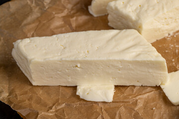 close-up of a piece of soft Caucasian cheese made from milk