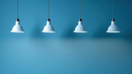 Lamps hanging from the ceiling with a blue wall. Copy Space